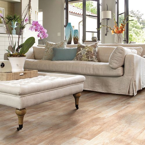 Light brown sofa on laminate floor from Prestige Flooring Center in Cathedral City, CA