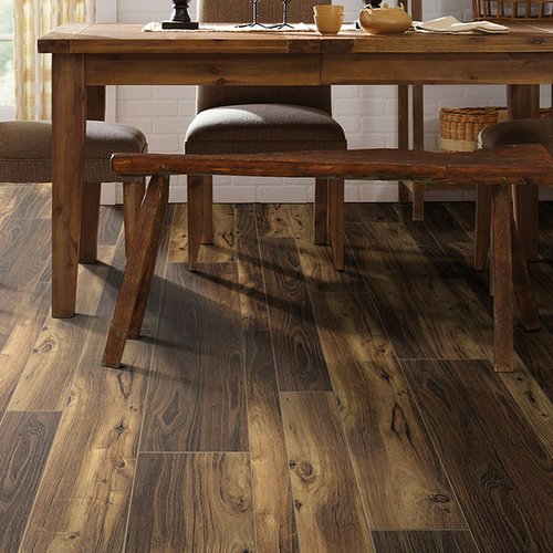 Wooden table with chairs on luxury vinyl flooring from Prestige Flooring Center in Cathedral City, CA