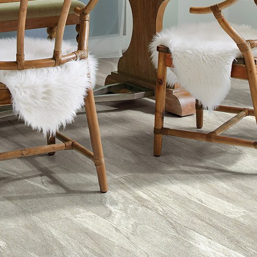 Wooden chairs on luxury vinyl flooring from Prestige Flooring Center in Cathedral City, CA