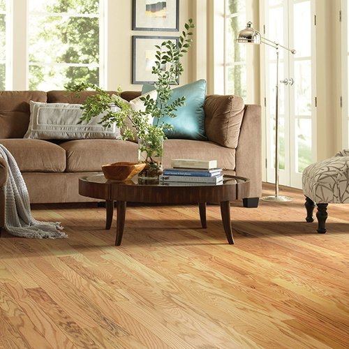 Brown sofa on hardwood floor from Prestige Flooring Center in Cathedral City, CA