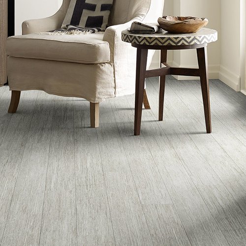 White armchair on luxury vinyl flooring from Prestige Flooring Center in Cathedral City, CA