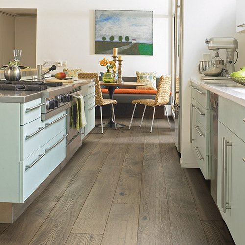 White kitchen furniture on hardwood floor from Prestige Flooring Center in Cathedral City, CA