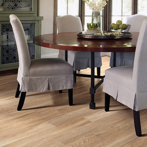 Brown table with grey chairs on luxury vinyl flooring from Prestige Flooring Center in Cathedral City, CA