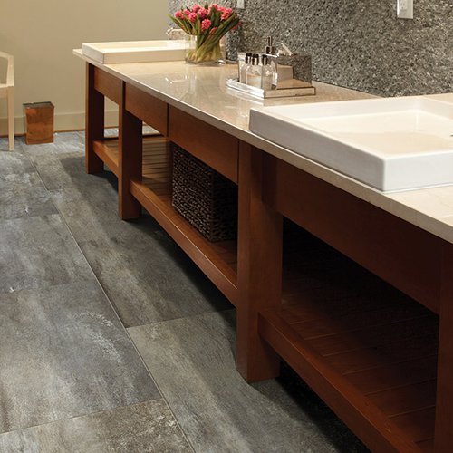 Grey luxury vinyl bathroom flooring from Prestige Flooring Center in Cathedral City, CA